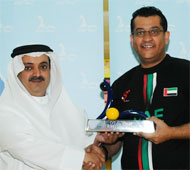 CHamp receiving trophy