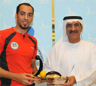 Khaled receiving trophy