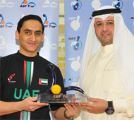 Hussain receiving trophy